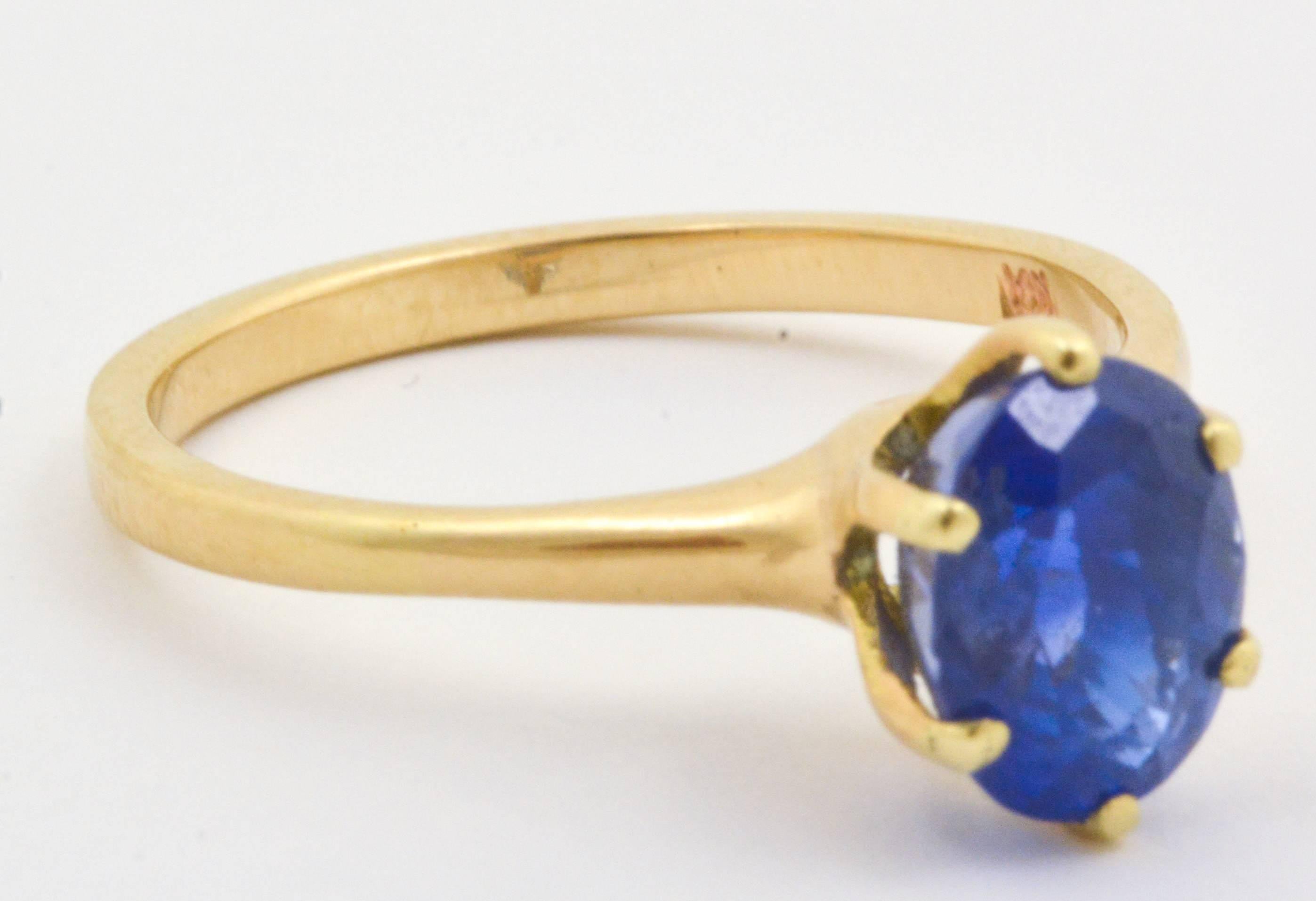 Modern 3.01 Carat Oval Blue Sapphire 14 Karat Yellow Gold Ring
