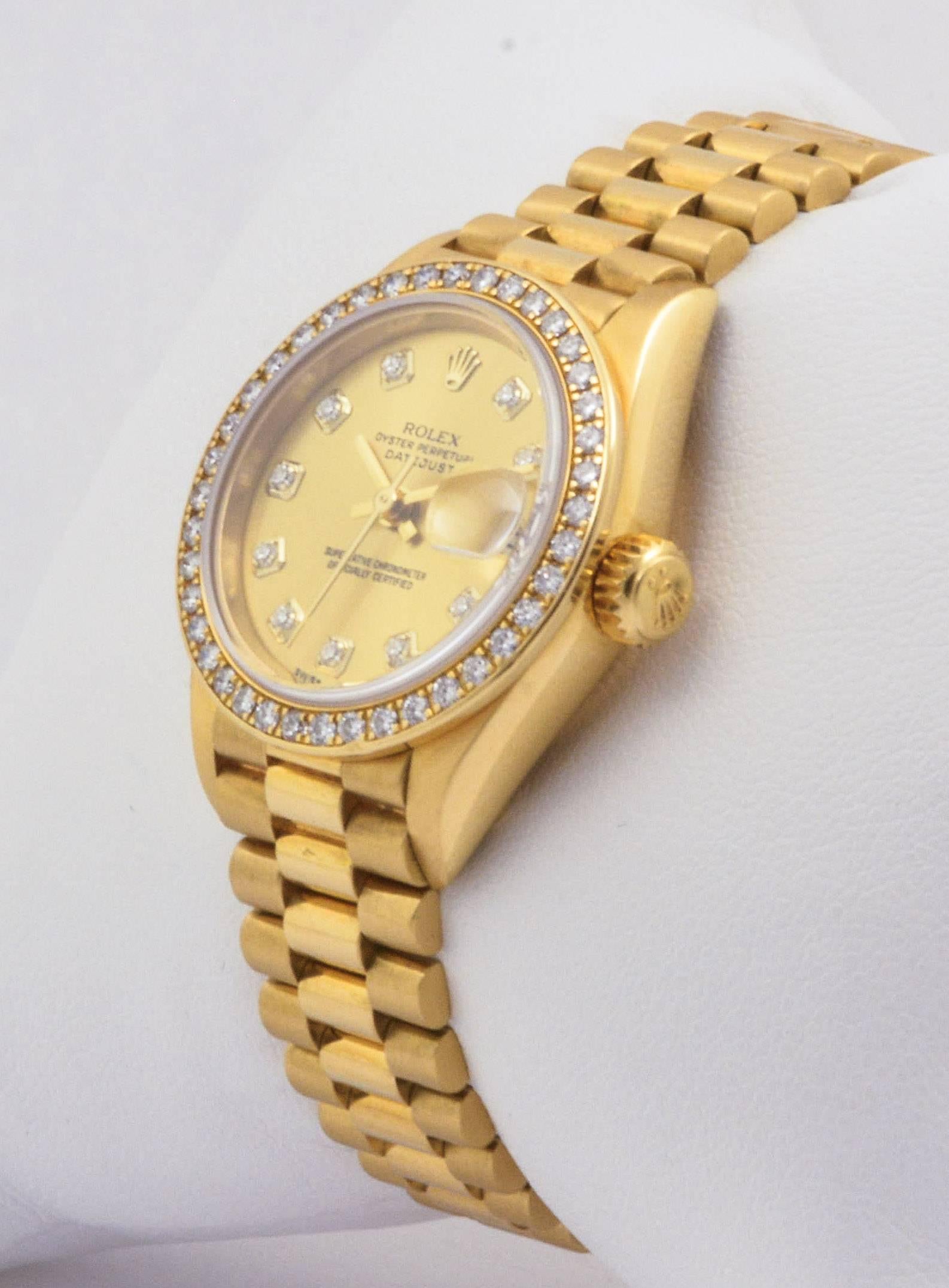 This 1995 vintage, certified pre-owned Presidential DateJust 26mm Rolex watch features a lovely champagne diamond dial, a diamond bezel, and a jubilee bracelet. This watch is in excellent condition, has been serviced by a Rolex certified watch