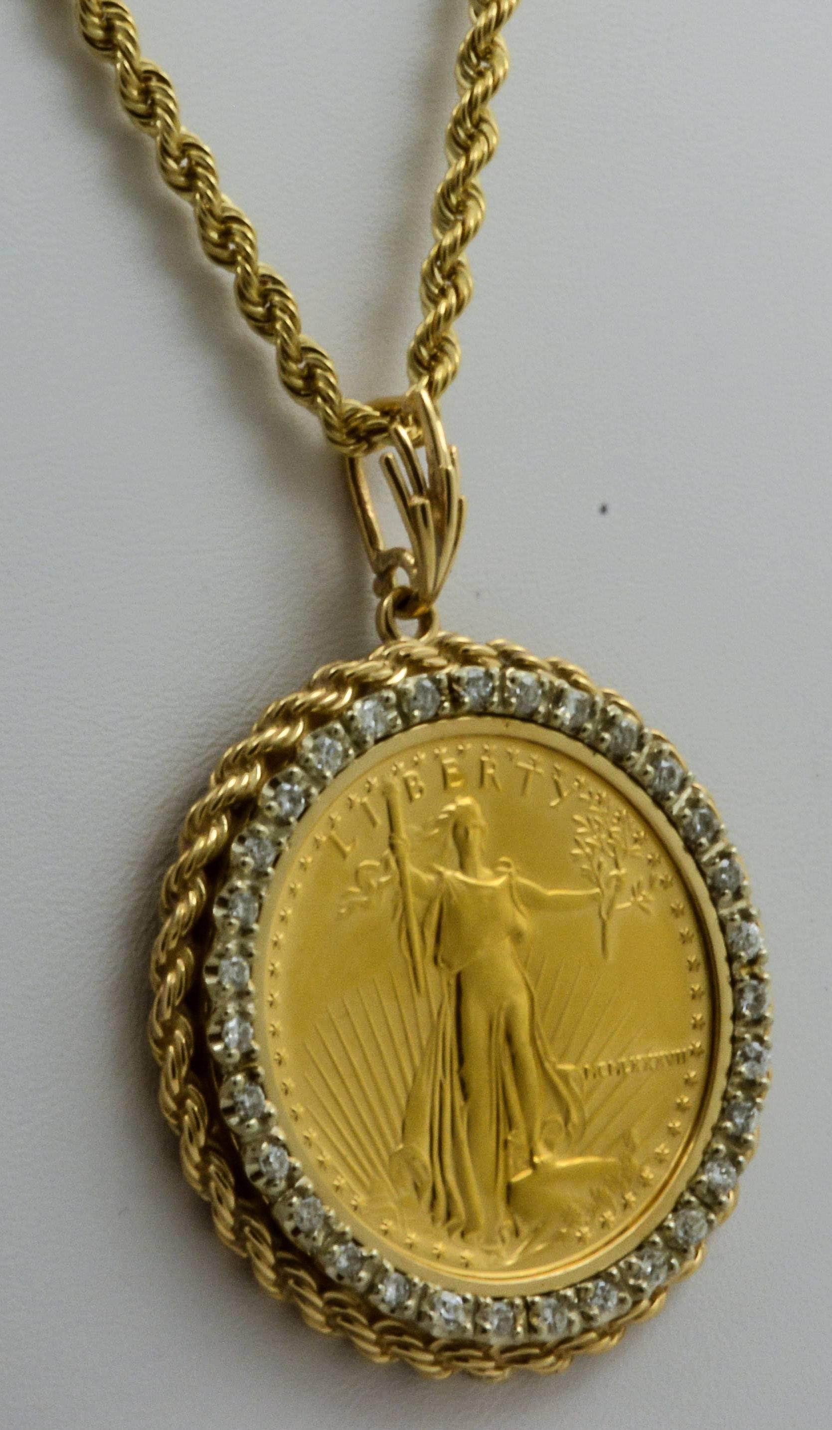 The $50 Liberty United States gold coin is commemorated with a bezel of thirty-one round brilliant cut diamonds (approximate combined weight 1.50 carats, clarity SI2 color G-H). An intricate rope border frames the piece and attaches to a 22in, 14kt