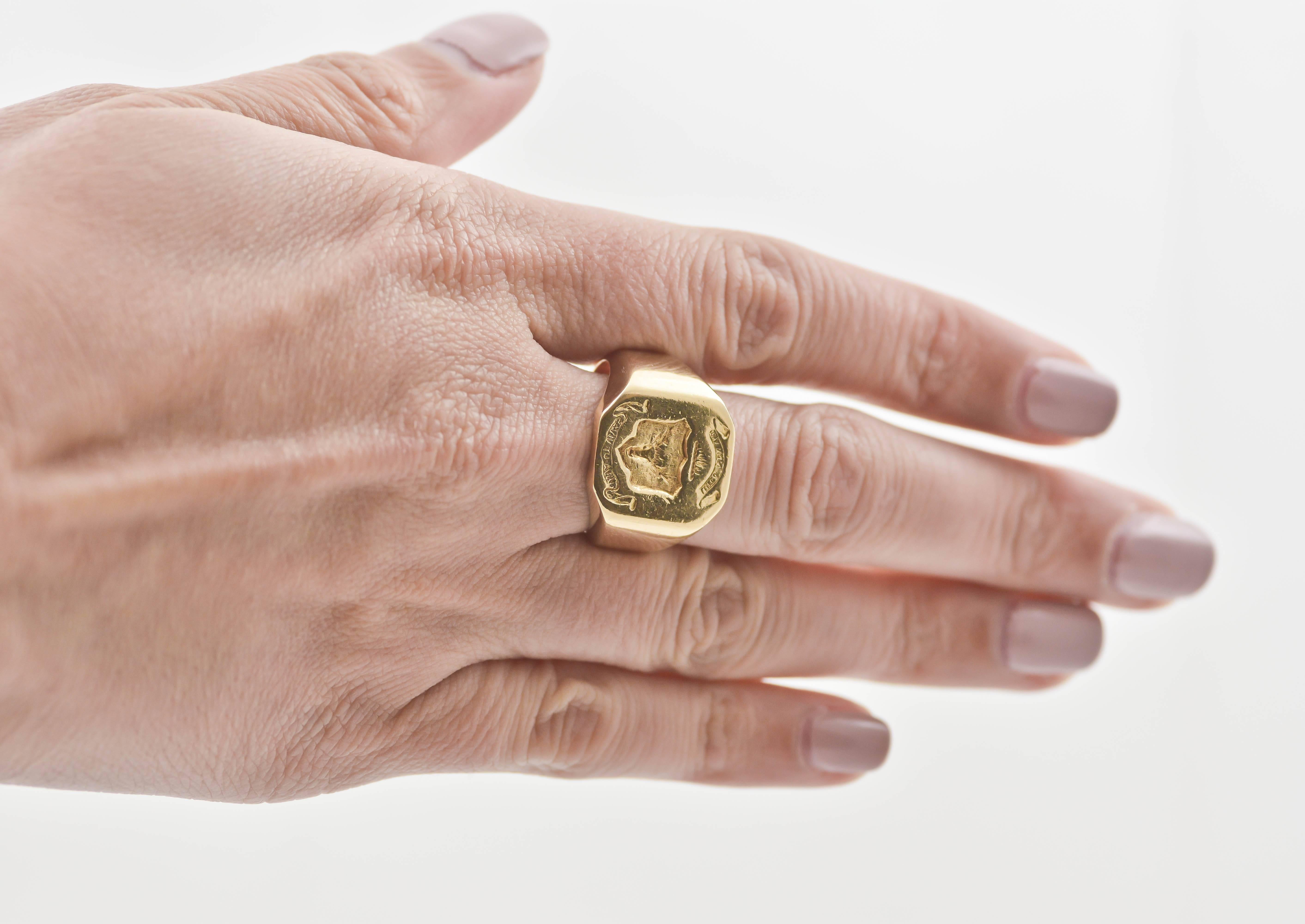 This classic, signet style crest ring is hand engraved with a shield bearing the image of a stag’s bust surrounded by ribbons of letters. The crest shown is for Clan Mackenzie, with the top line reading 