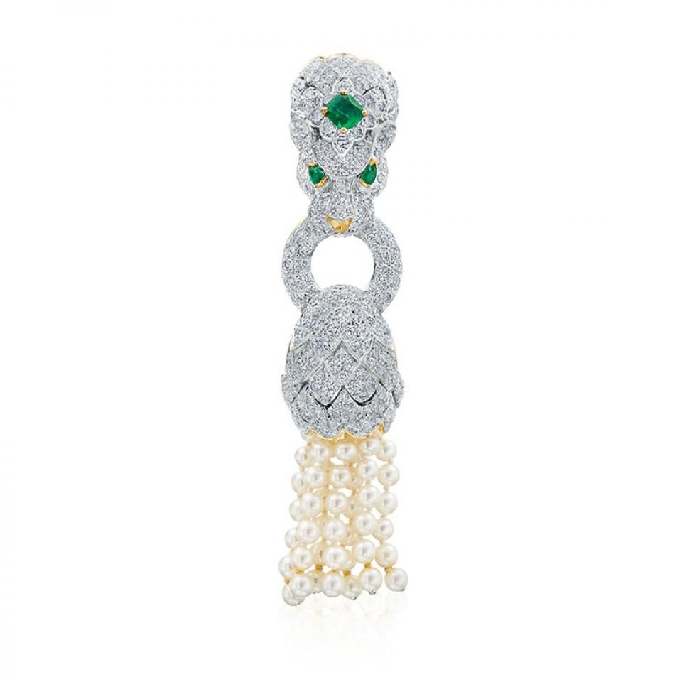 Driven by art, design and bold pieces this lion converting bracelet and brooch embodies David Webb’s roaring and grand pearl statement. The bracelet is strung with seven strands of cultured pearls, the lion's head is surrounded with 256 pave round