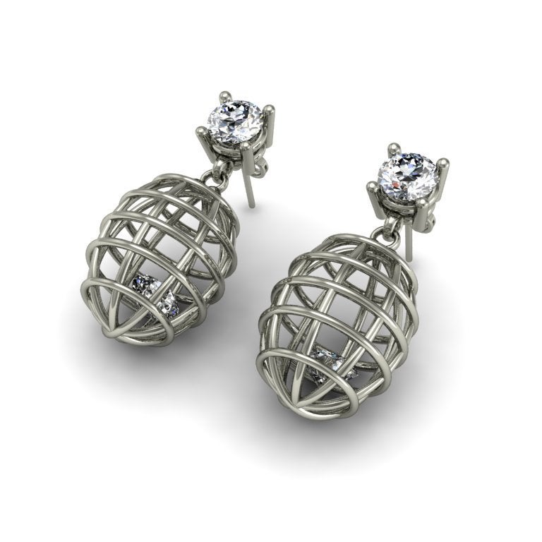 These earrings encase a precious gem within a caged setting to evoke an edgy atmosphere. This is a very cool and fashion-forward look for the modern woman.