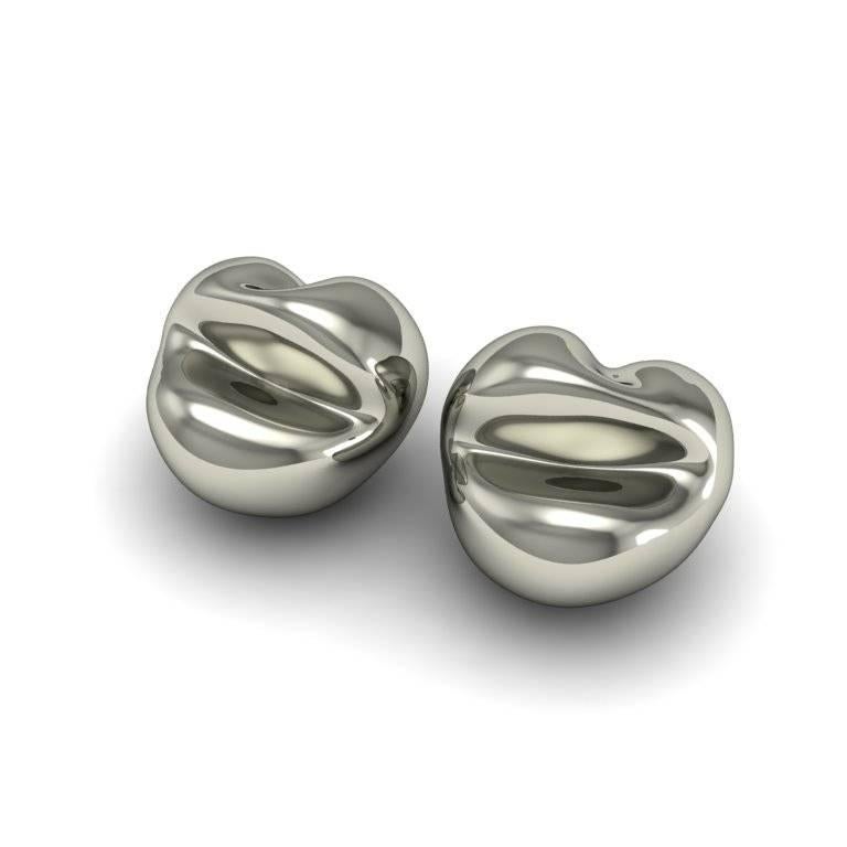 The unconventional curves and seams in these earrings create a unique contemporary edge. The lip motif references art, but are also abstract and a little bit mysterious.