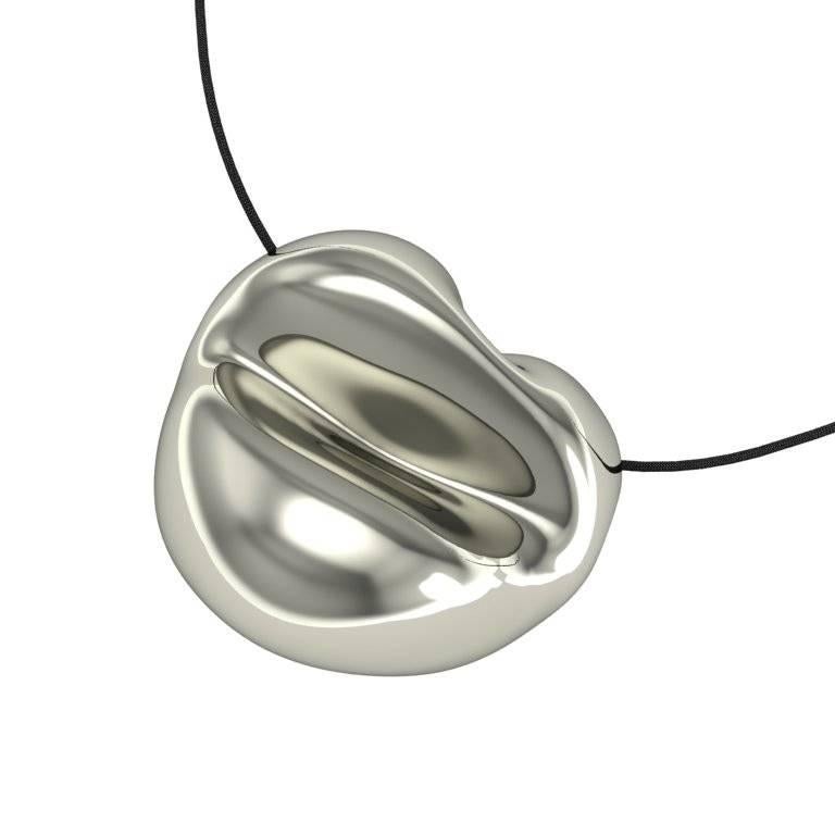The unconventional curves and seams in this pendant gives it a unique contemporary edge. The lip motif references art, but is also abstract and a little bit mysterious.