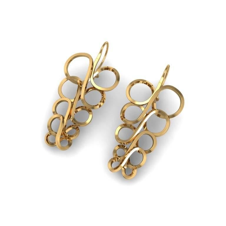 An atmosphere of art nouveau surrounds this stunning pair of earrings that sees one piece curve its way into a series of circular shapes. They are both delicate and beautiful and also versatile enough to be worn on almost any occasion.