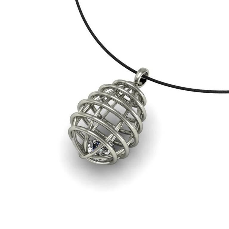 A gem caged in a setting to evoke an edgy atmosphere. The type of chain selected can add a casual or more formal finishing touch to this very cool look.