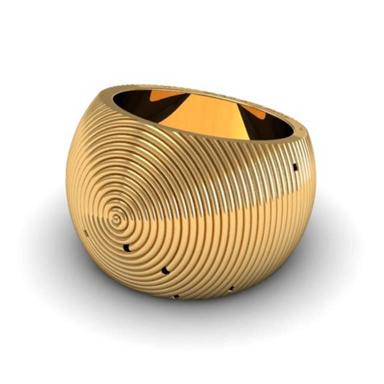 The continued convex curves build up to a point in this architectural ring that is striking for its use of lines.