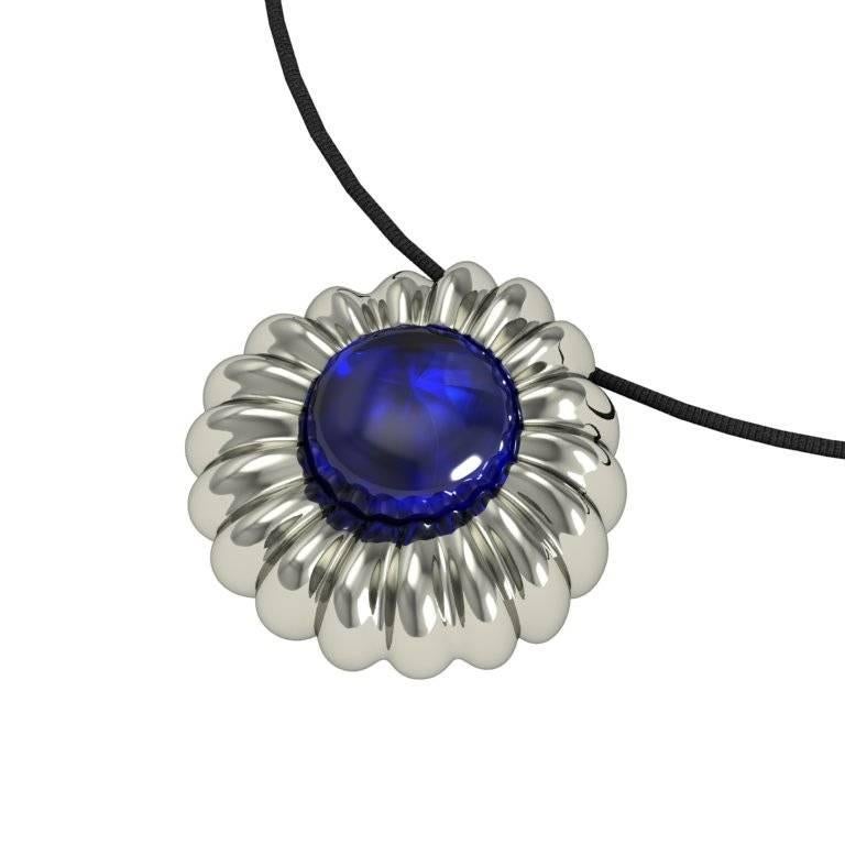An intricate flower motif surrounds a boastful gem in this romantic pendant that can be dressed up or down depending on the selected chain.