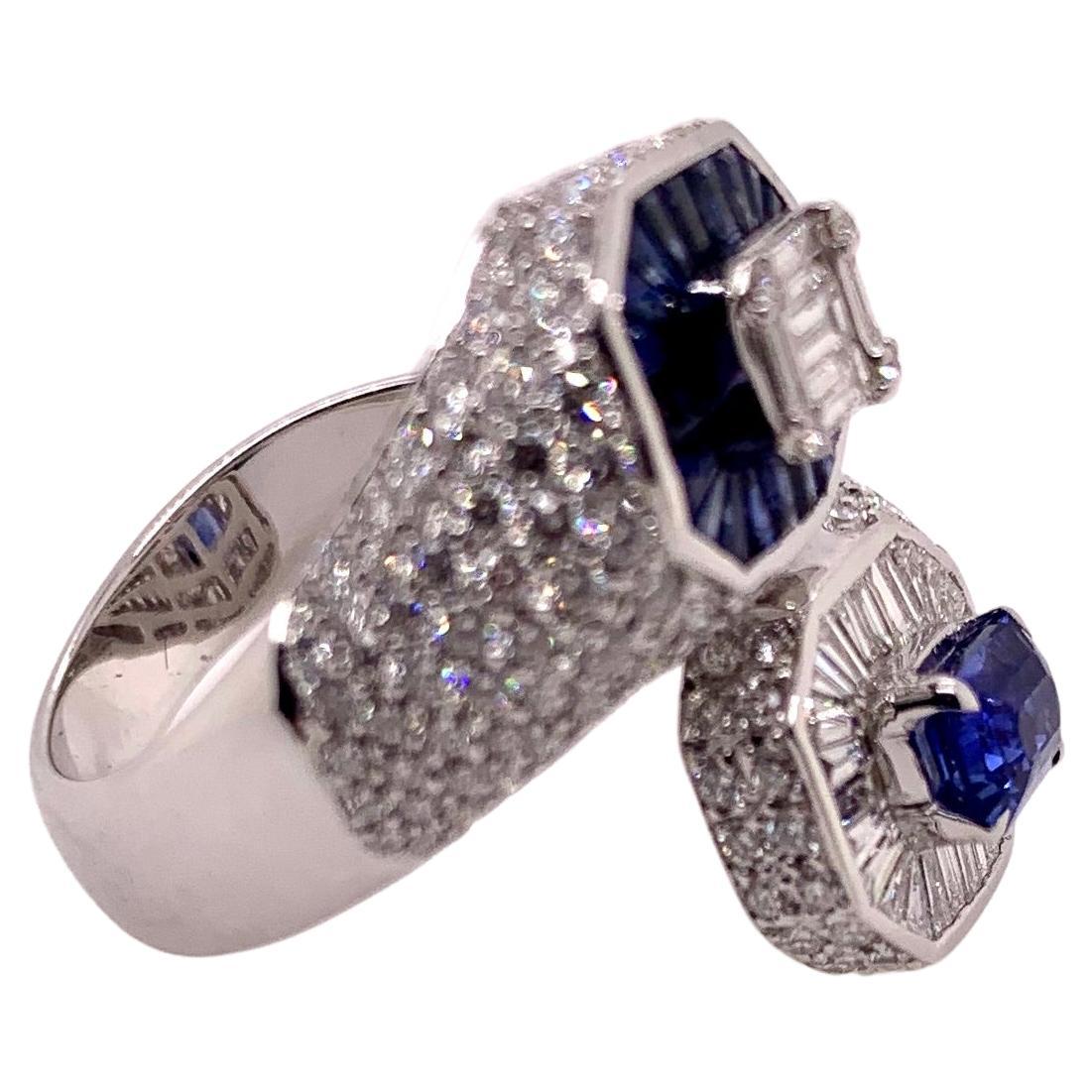 A classic combination of sapphires and diamonds in an unusual bypass style ring!  The alternating pattern gives a gorgeous contrast of the rich blue hue in the sapphires against the white diamonds in this stunning ring! 

Sapphires:  1.22 cts,