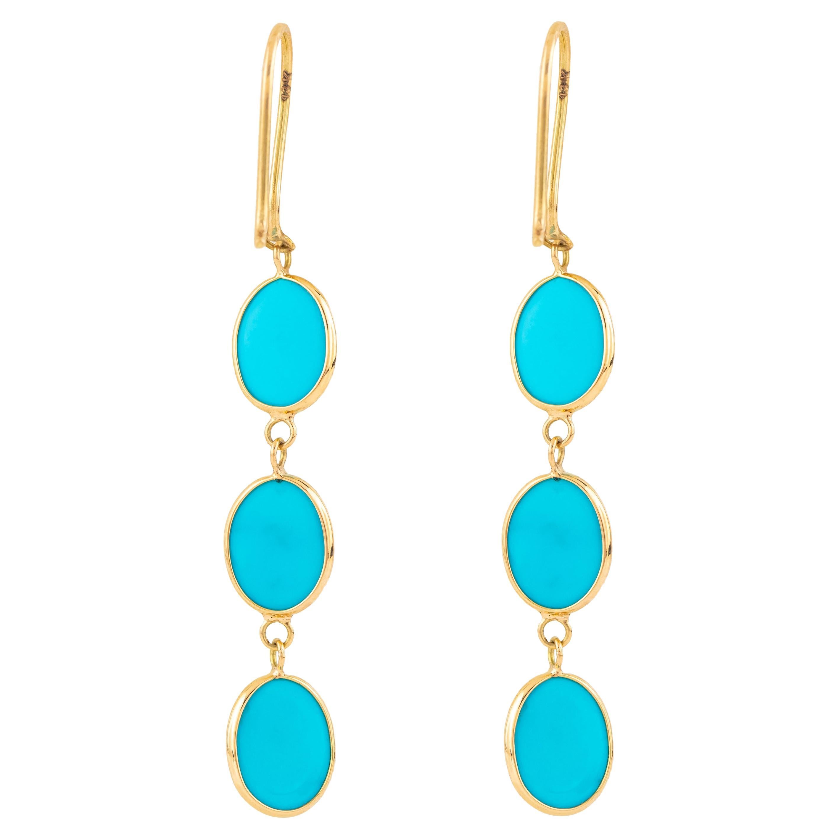 Step into a realm of timeless elegance with our 18 Karat Gold 6.1 Carat Turquoise Dangle Earrings, where sophistication meets impeccable craftsmanship. Each pair is a manifestation of our dedication to creating jewelry that transcends trends,