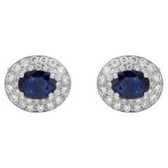 Coppia di gemelli con doppio alone di zaffiro blu ovale e diamanti naturali in oro bianco 18 carati