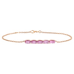 Bracciale minimalista con zaffiro rosa naturale ovale, incastonato a castone, in oro rosa 18 carati