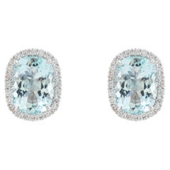 Elongated Cushion Aquamarine & Diamond Halo Stud Earrings in 18 Karat White Gold