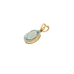 Classic Oval Natural Aquamarine & Diamond Halo Pendant in 18K Yellow Gold Bail