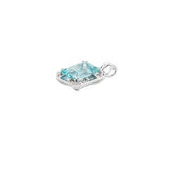 Contemporary Emerald Cut Aquamarine and Round Diamond Halo Pendant White Gold