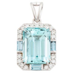 Contemporary Emerald Cut Aquamarine and Round Diamond Halo Pendant White Gold