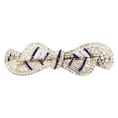 Art Deco Chic and Sophisticated Sapphire Diamond Platinum Lacy Bow Pin Art Deco Chic and Sophisticated Sapphire Diamond Platinum Lacy Bow Pin