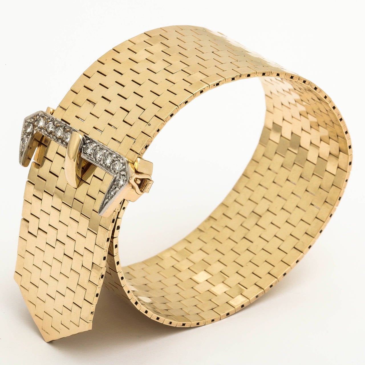One 14kt yellow gold brick mesh bracelet consisting of 12 brilliant cut  full cut diamonds with an approximate total weight of 1.00 ct beautifully designed bracelet crafted to look like a belt with the belt buckle in diamonds. This Bracelet Is