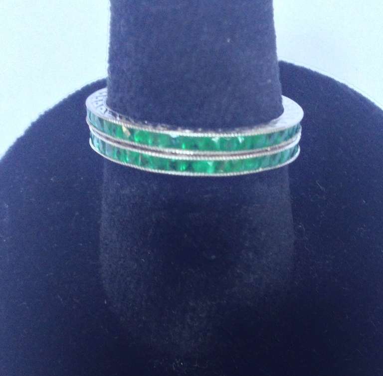 Pair of Emerald Platinum Eternity Bands In Excellent Condition In New York, NY