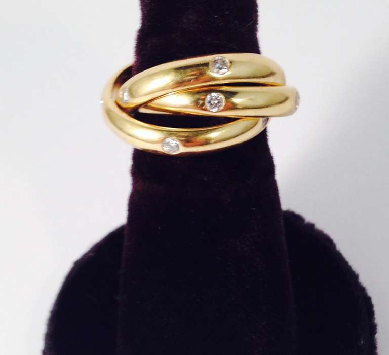 Cartier Triple Intertwined Gold and Diamond Rolling Rings In Excellent Condition In New York, NY