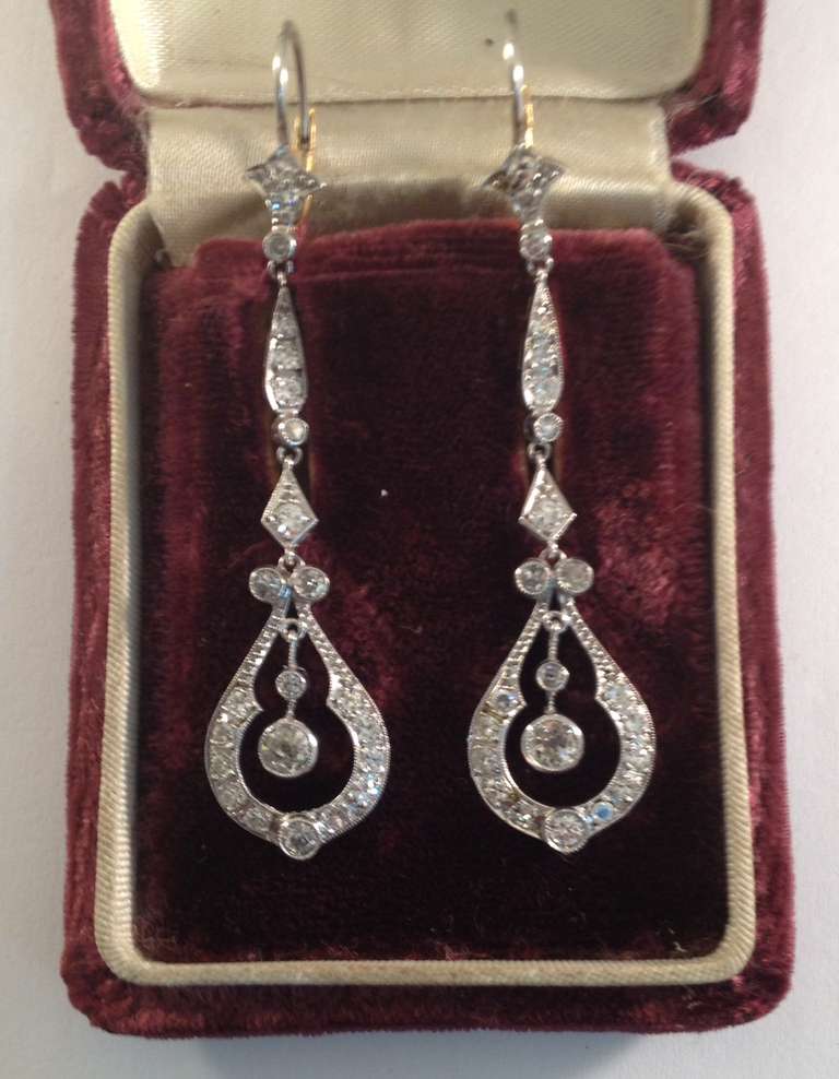 Art Deco Long Dangle Earrings consisting of old European cut diamonds with handmade open workmanship design. Total diamond weight 2 .25 cts.  European made in the 1920s.