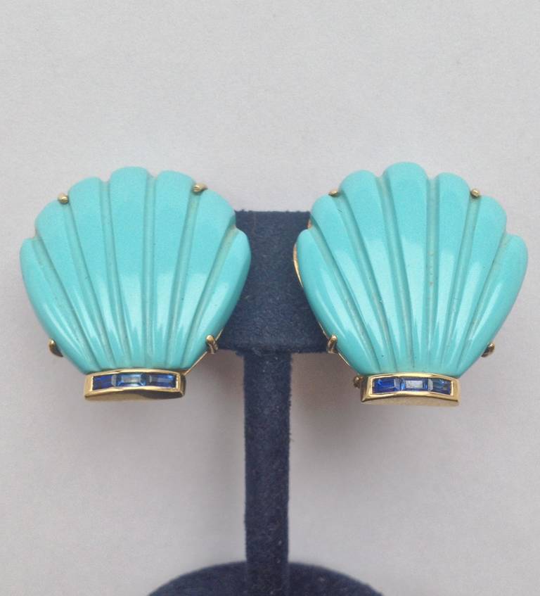 18kt yellow gold and custom cut Turquoise  In Form of A shell Earrings with hand carved fluted beautiful color Turquoises and horizontal square cut caliber cut beautiful color matching natural sapphires with moveable retracable posts may be worn for