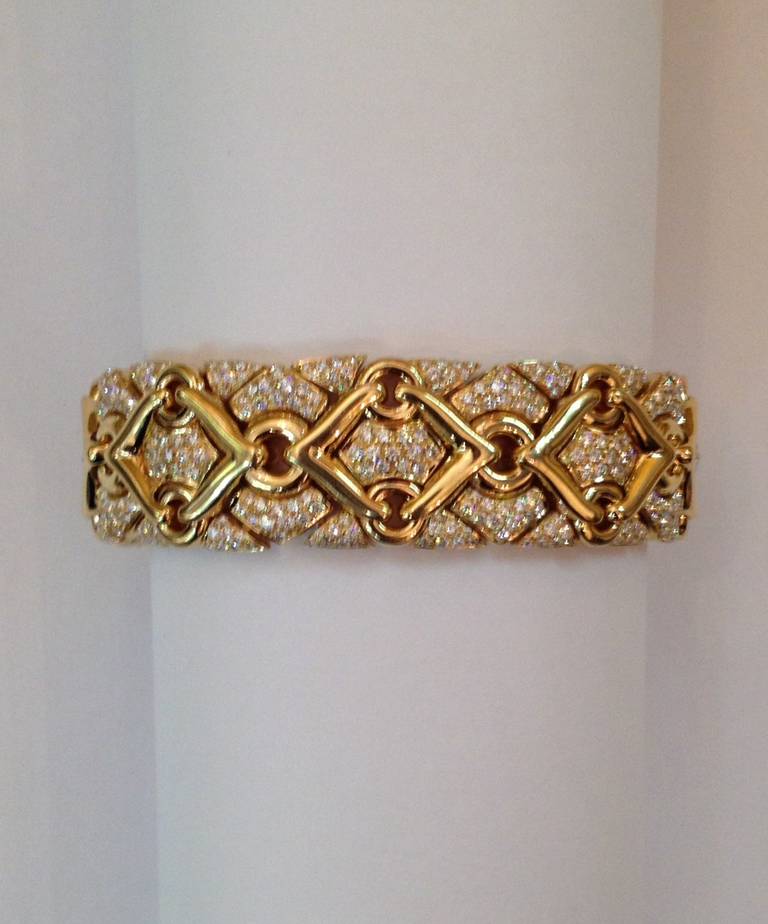 18KT Heavy, Gold And Diamond, Flexible Bracelet, With Eyelets And Lacing Craftsmanship, Designed By BULGARI, From The Trika Collection, Circa 1980's, Total Diamond Weight Is Approximately 9 Cts., Of Very High Quality, Full Cut Diamonds, Made in