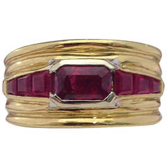 1970s Handmade Calibre Cut and Rectangular Cut Ruby Gold Ridges Band Ring