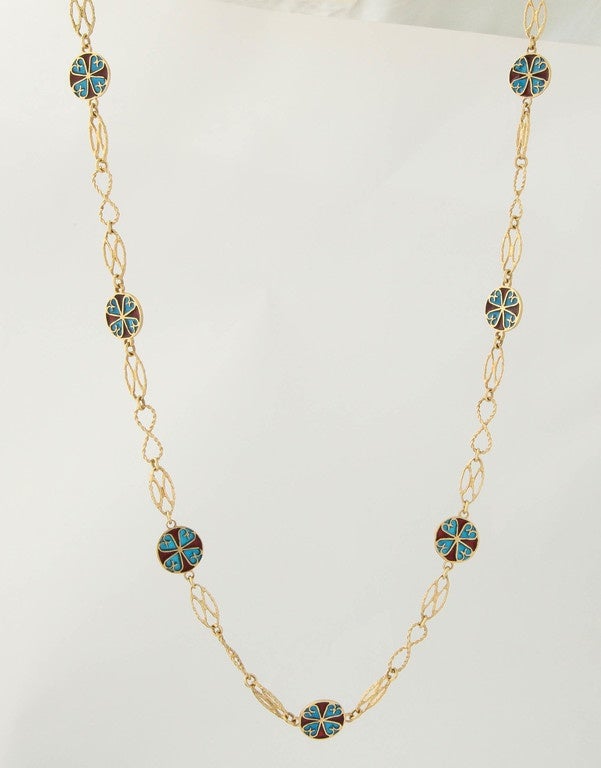 One 18kt Yellow Gold open Handmade Link Chain/Necklace Designed With 12 Circular Plique-A-Jour Transparent Aqua Blue And Red Enamel Circular Plaques.Chain is beautiful made in a Hand-Hammered Rope Design Effect And Has 2 Alternating Patterns