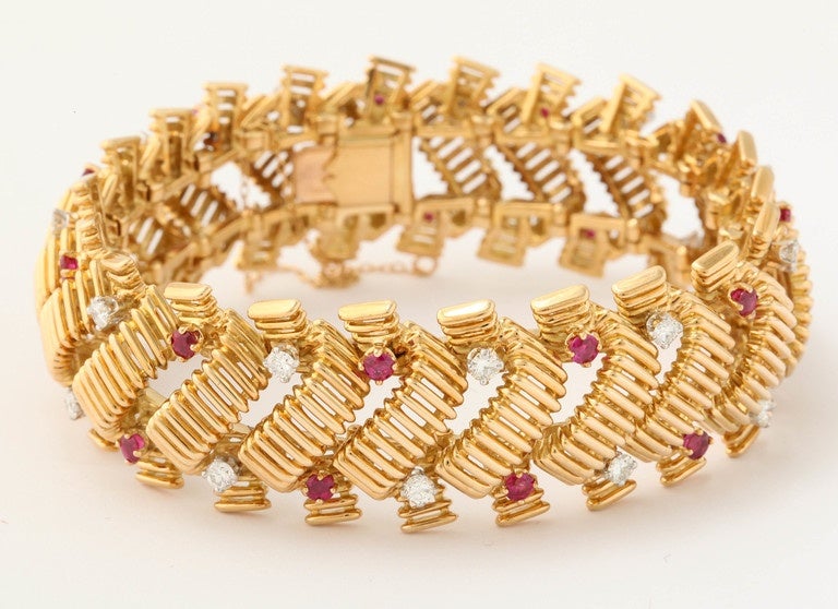 18kt ridged gold Flexible Bracelet Consisting of 22 high quality full cut diamonds weighing approximately 2 carats and further embellished with 22 faceted beautiful color rubies weighing approximately 2 carats total weight. this bracelet is