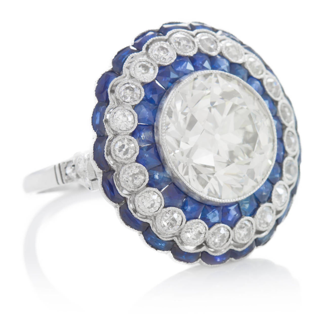 This ring is amazing. From the filigree to the milgrain, to the rose cut sapphires and perfectly chosen diamonds that complement the 5.12ct european cut diamond in the center, this ring has it all. Rings like this are what inspire the modern art
