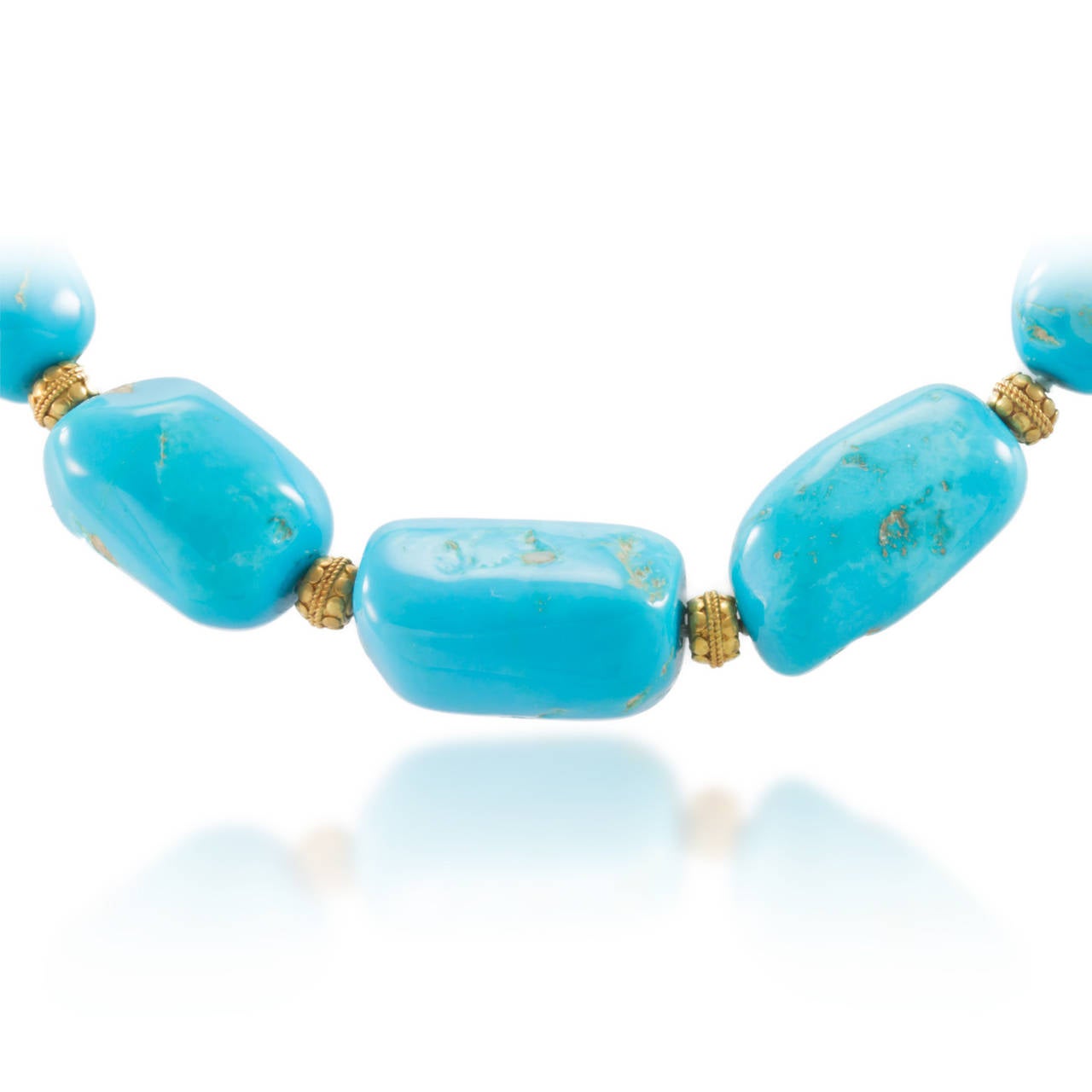 Lady's sing strand Turquoise bead necklace with a 14K yellow gold (stamped) hook clasp and twelve (12) yellow gold beads. Construction is cast and hand strung with good workmanship. 

Tumbled Beads:
Size: 17.64 x 13.23-26.00 x 16.05
Color: