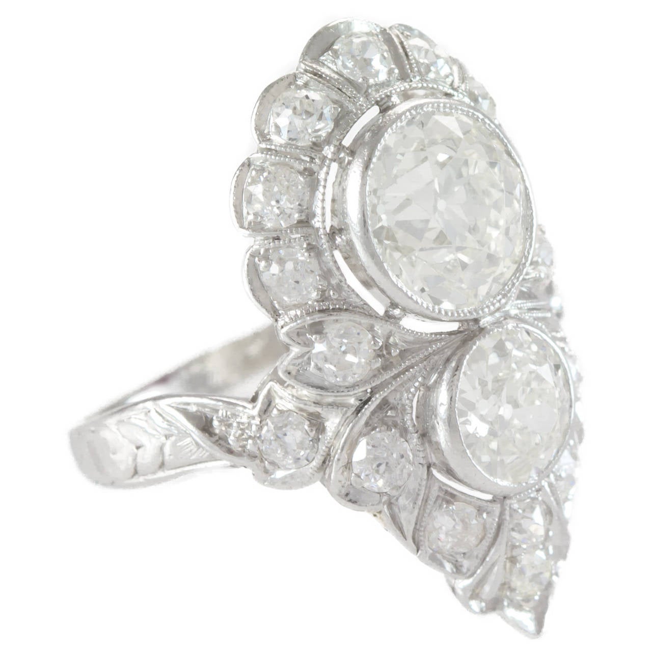 Lady's Art Deco Two-Stone Dinner Ring features a 2.0 carat Old European cut diamond punctuated by a 0.90 cart Old European Cut diamond. These stones are surrounded by a melange of single cut diamonds with an approximate weight of 1.0 carats. While