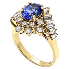 Vintage Oval Tanzanite Ring with Round and Baguette Diamonds Set in 14k Gold