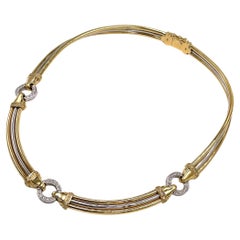Collana con collare di diamanti bicolore in oro giallo e bianco 18 carati, connettori circolari
