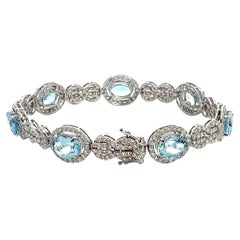 Pulsera Oro Blanco 18K Aguamarinas Ovaladas 10.91 Quilates
Diamantes Redondos 4.63 Quilates