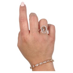 4.74 Carat Oval Morganite Ring with 0.44 Carat Halo of Diamonds in 14K Rose Gold