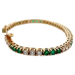 Tennisarmband aus 18 Karat Gelbgold mit Smaragd und Diamant