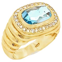 East West Blue Topaz Ring, Ridged with Halo Round Diamonds in 18K Yellow Gold