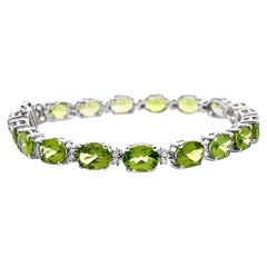 Oval Peridot and Diamond Bracelet Prong Set in 14K White Gold with Safety Latch