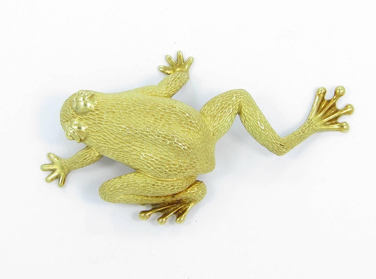 Here is a very neat estate piece. It is a Henry Dunay 18k yellow gold Frog Pin. Details are well done in this pin from the eyes to the feet. Pin weighs 24 grams and measures 2.25 inches in length from nose to foot and 1.50 inches from right foot to