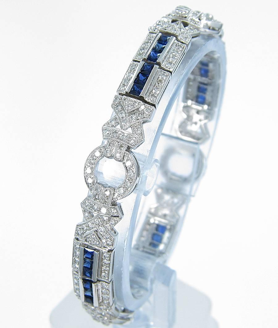This beautiful bracelet has a vintage flare. There are approximately 3.32cts of round brilliant cut diamonds and 2.40cts of square cut sapphires. This is a meticulously put together bracelet. Sapphires are of great quality and color as you can see
