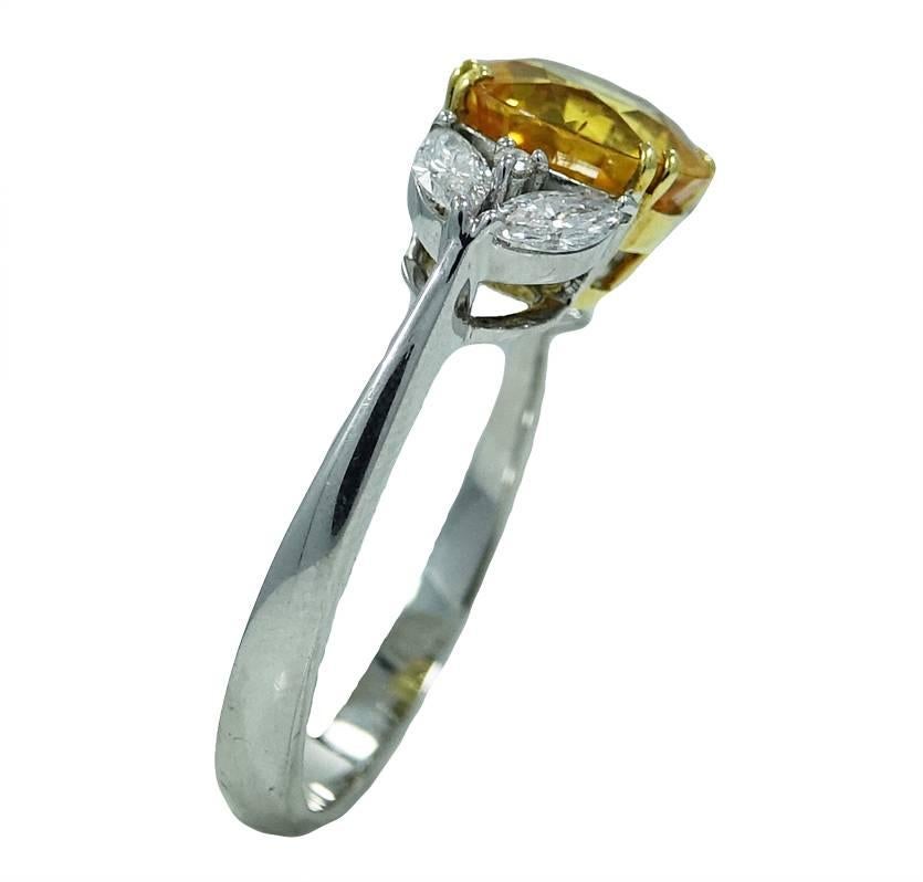 18K White Gold Ring With Center Round Cut Yellow Sapphire With A Total Carat Weight Of 3.20ct and 2 Diamonds Weighing A Total Carat Weight Of .40ct. This Ring Is A Size 6.5 and is Sizable.