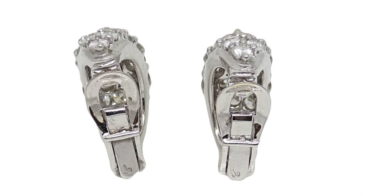 These Gorgeous Platinum Earrings Are Covered In Round Brilliant Diamonds Weighing A Total Carat Weight Of 4.50 Carats. In the Center Of these Earrings A Fancy Intense Rectangular Brilliant Pink Diamond Lays In The Center Weighing A Total Carat