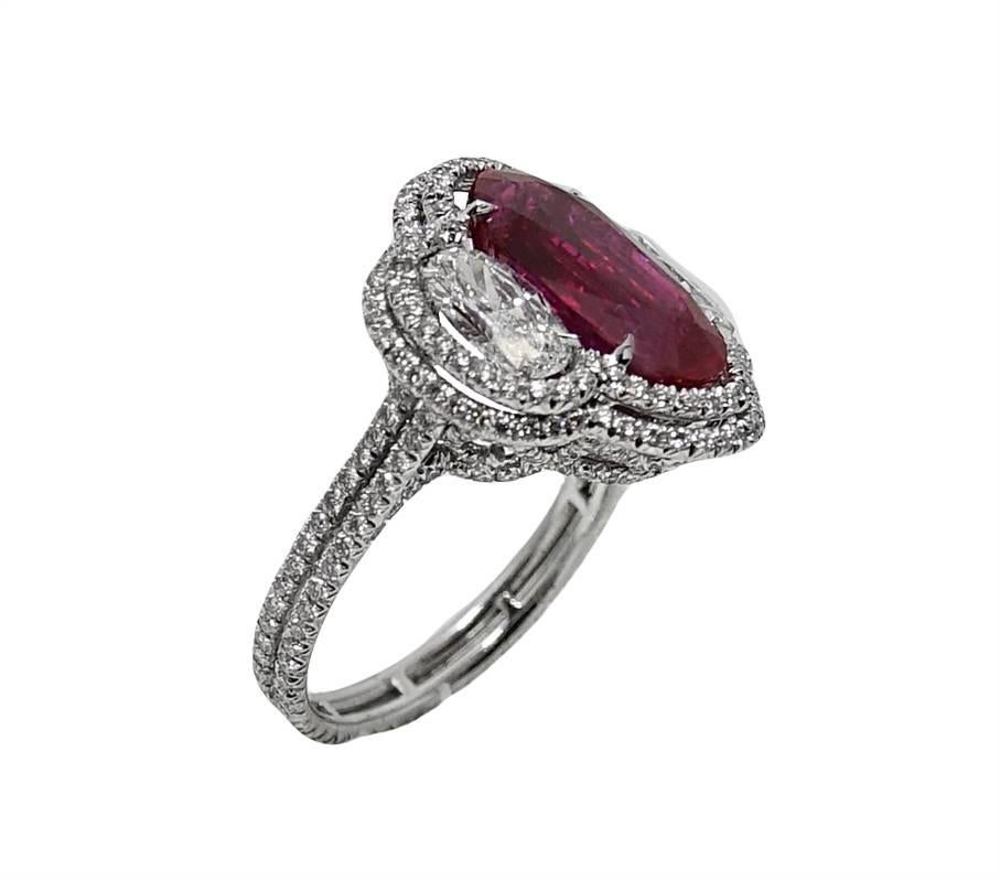 This Timeless 18K White Gold Ring Has A Center Oval No Heat Burma Ruby Weighing A Total Carat Weight Of 5.37 Carats. The Mounting of This Ring Is Completely Covered In Diamonds Weighing A Total Carat Weight Of 3.00 Carats. AGL Certificate Report