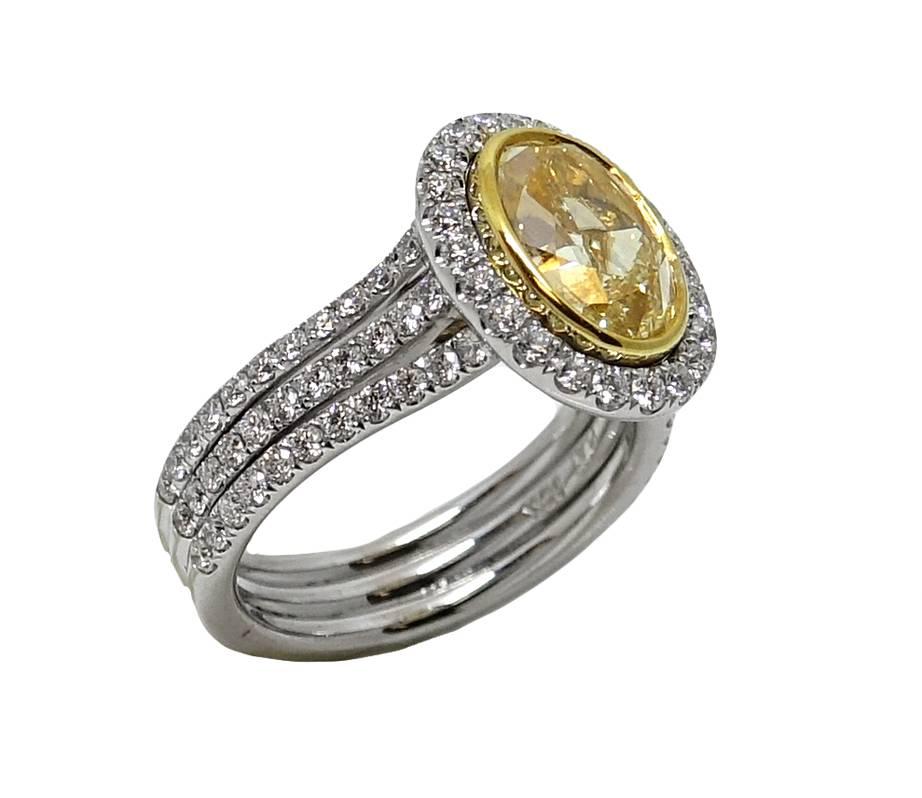 3.01 Carat Yellow Oval Cut Diamond Platinum Engagement Ring In Excellent Condition For Sale In Naples, FL