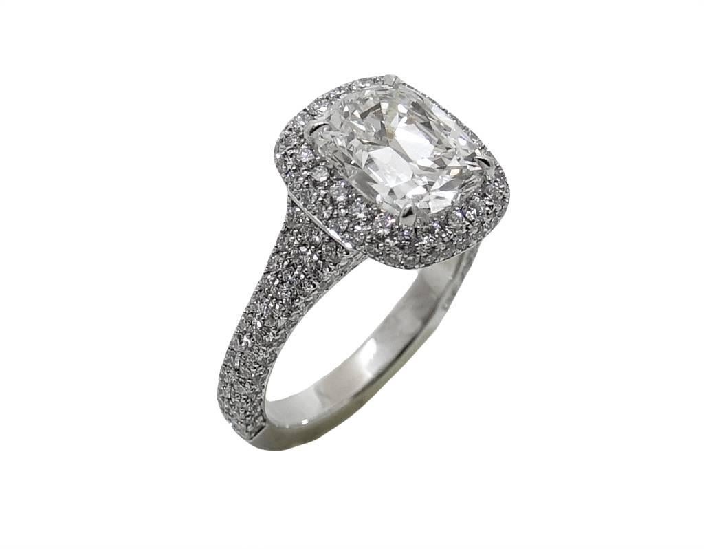 Platinum Ring With Center Cushion Cut Diamond Weighing A Total Carat Weight Of 3.02 E Color and VS2 Clarity (GIA Report) 176 Round Diamonds Weighing A Total Carat Weight Of 1.54 Carats. This Ring Has A micro Paved Halo On The Top and Side With A