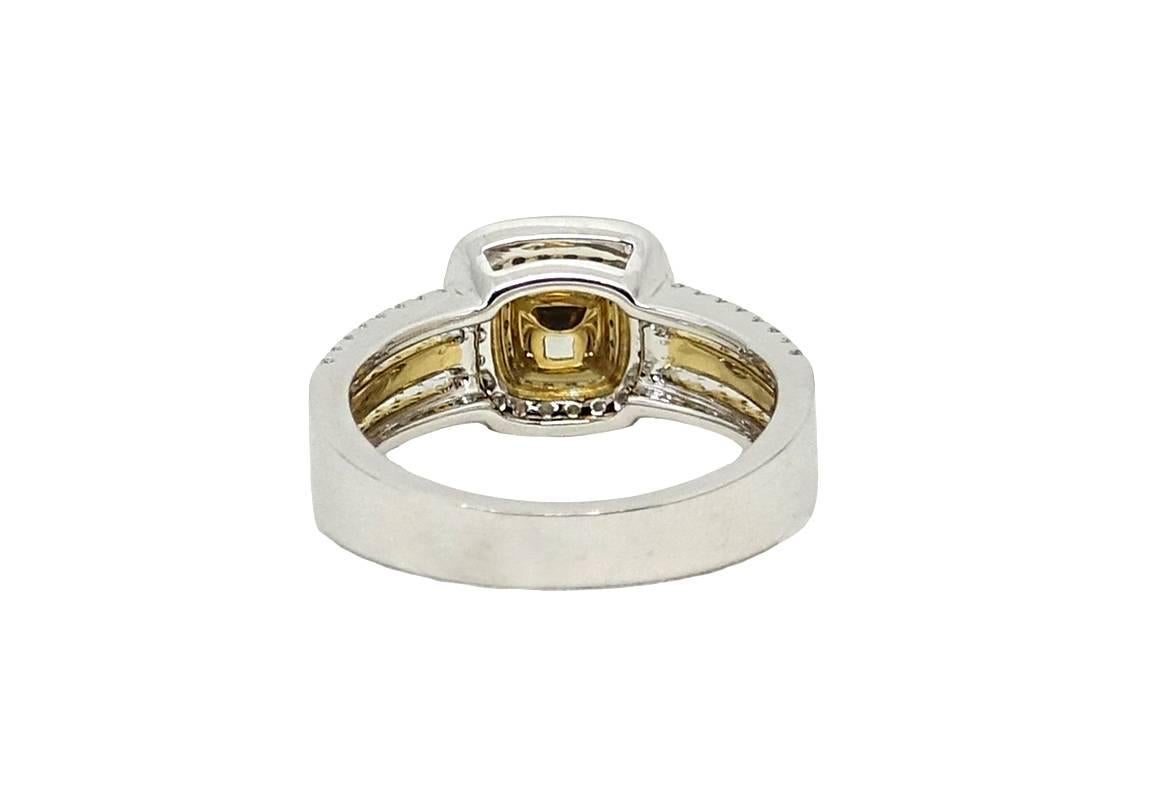 18K Yellow and White Gold Ring With Center Cushion Cut Yellow Diamond Weighing A Total Carat Weight Of 1.01 Carats VS2 Clarity (GIA Report: 6222538346) and White Diamonds Weighing A Total Carat Weight Of 0.33 Carats G-H Color and VS2-SI1 Clarity.