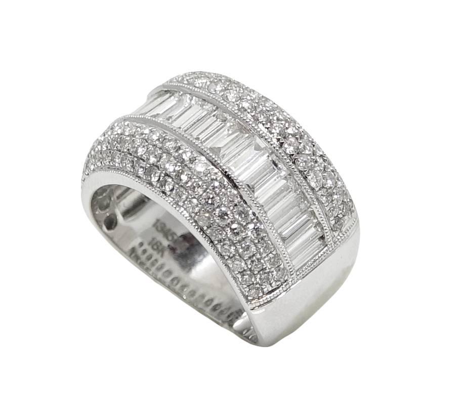 18K White Gold Band Ring With Approximately 22 Baguette Cut Diamonds Weighing A Total Carat Weight Of 1.40 Carats and Approximately 112 Round cut Diamonds Weighing A Total Carat Weight Of 1.08 Carats. This Ring Is A Size 7 and Can Be Sized Upon