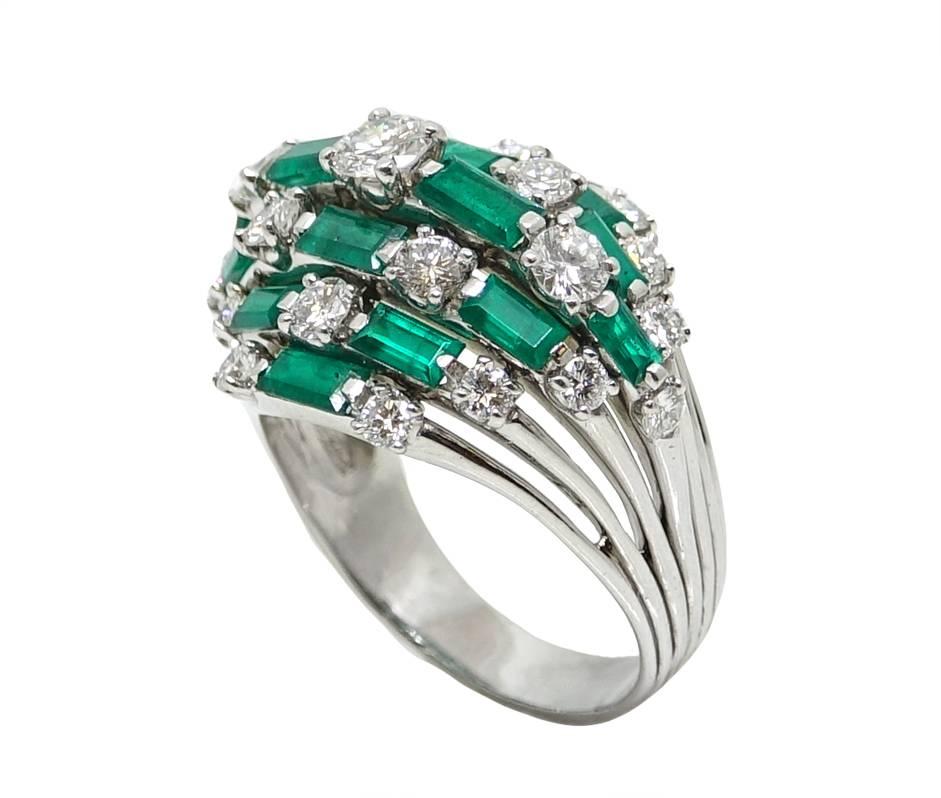 Platinum Ring With Baguette Cut Emeralds and Round Cut Diamonds Weighing A Total Carat Weight Of 2.00 Carats, This Ring Is A Size 10.5 and Can Be Sized Upon Request.